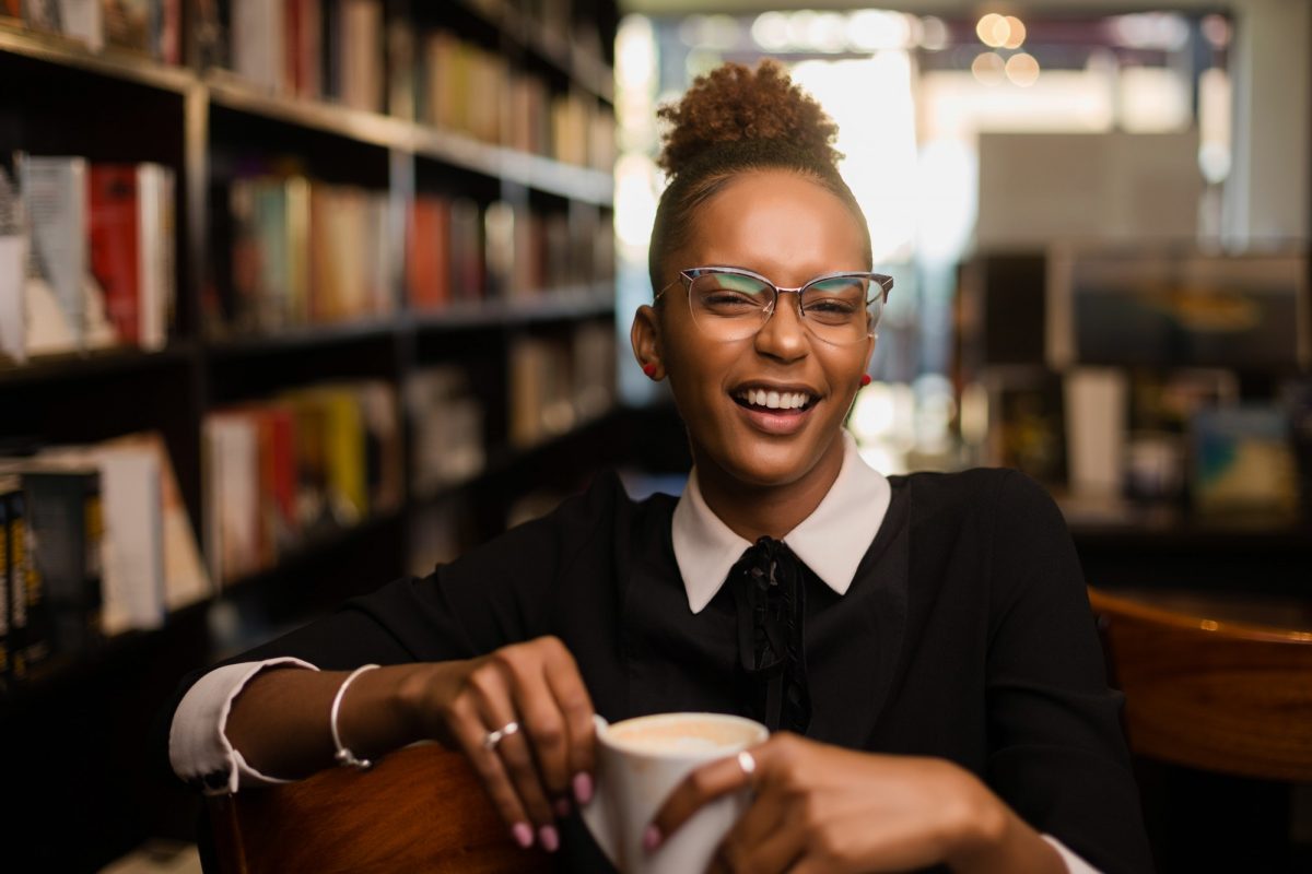 Black african american young yoman drinking coffee