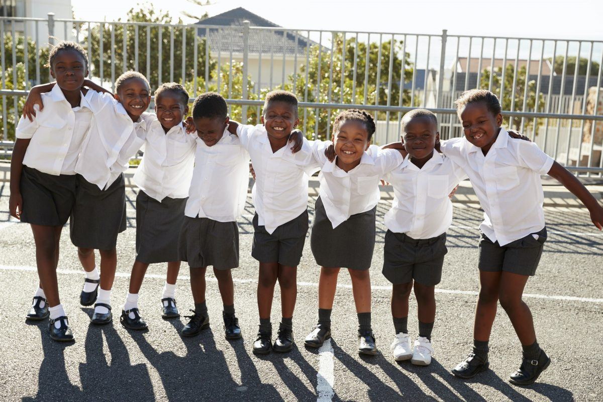 Elementary school kids in Africa posing in school playground